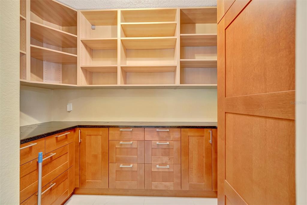 614 Norton Street Longboat Key, FL 34228 - Photo 26 of 71 a view of a room with shelves