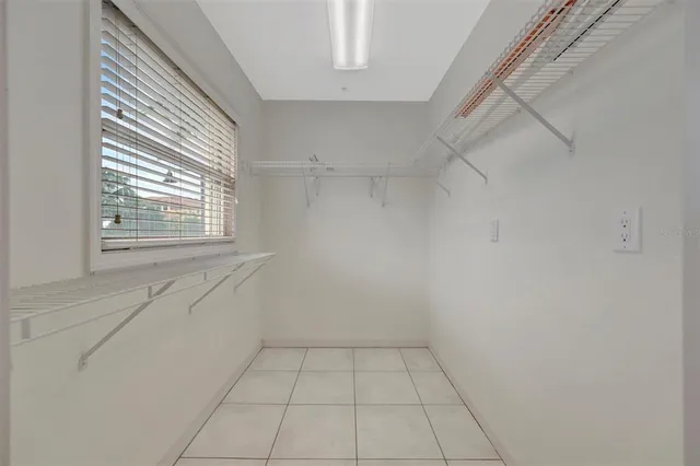 a kitchen with stainless steel appliances a refrigerator and a stove top oven