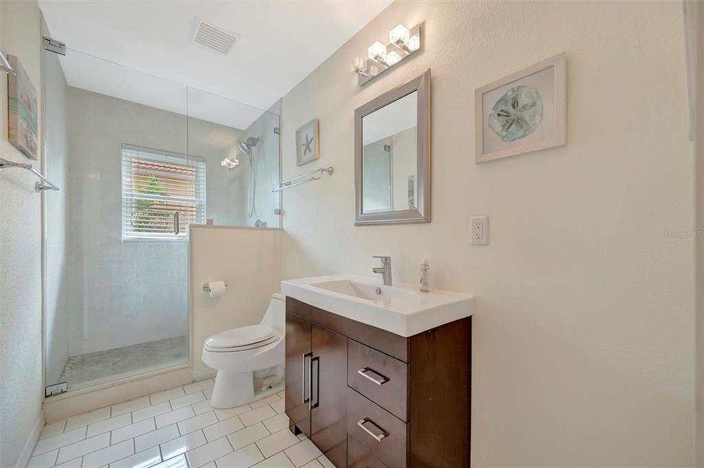 614 Norton Street Longboat Key, FL 34228 - Photo 35 of 71 a bathroom with a toilet sink and mirror