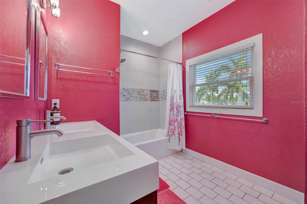 614 Norton Street Longboat Key, FL 34228 - Photo 53 of 71 a bathroom with a sink a bath tub and a shower