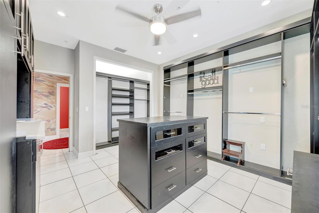 614 Norton Street Longboat Key, FL 34228 - Photo 54 of 71 a kitchen with stainless steel appliances cabinets and front door