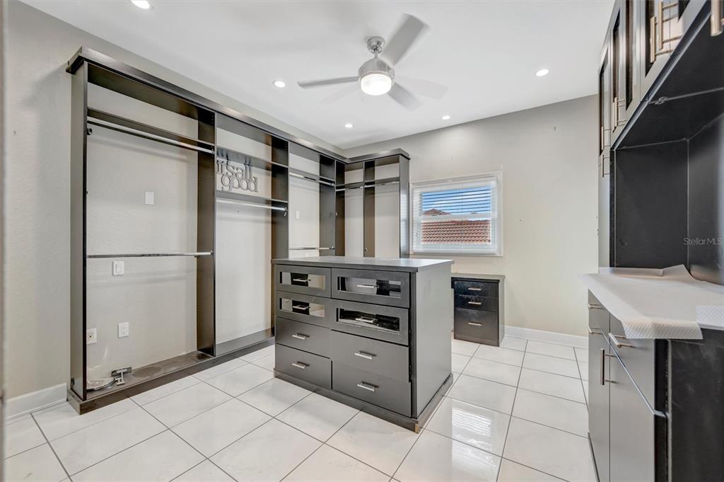 614 Norton Street Longboat Key, FL 34228 - Photo 56 of 71 a kitchen with stainless steel appliances a refrigerator and a stove top oven