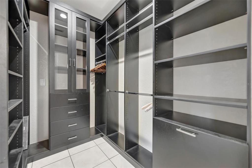 614 Norton Street Longboat Key, FL 34228 - Photo 57 of 71 a view of walk in closet with empty racks