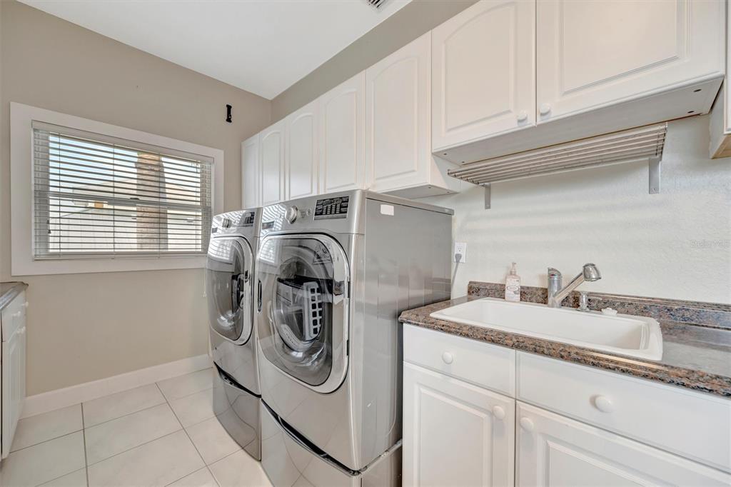 614 Norton Street Longboat Key, FL 34228 - Photo 62 of 71 a utility room with dryer and washer