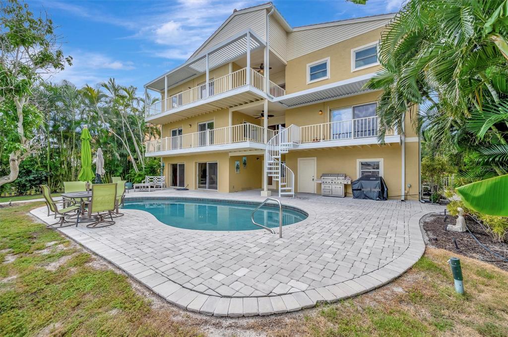 614 Norton Street Longboat Key, FL 34228 - Photo 64 of 71 a view of a building with a swimming pool