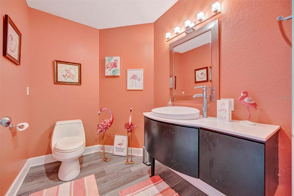 614 Norton Street Longboat Key, FL 34228 - Photo 7 of 71 a bathroom with a sink toilet and a mirror