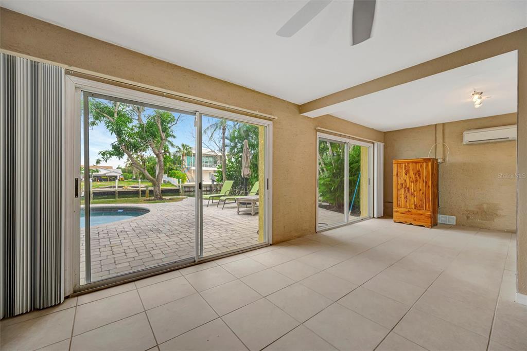 614 Norton Street Longboat Key, FL 34228 - Photo 8 of 71 a view of an empty room with window and a living room