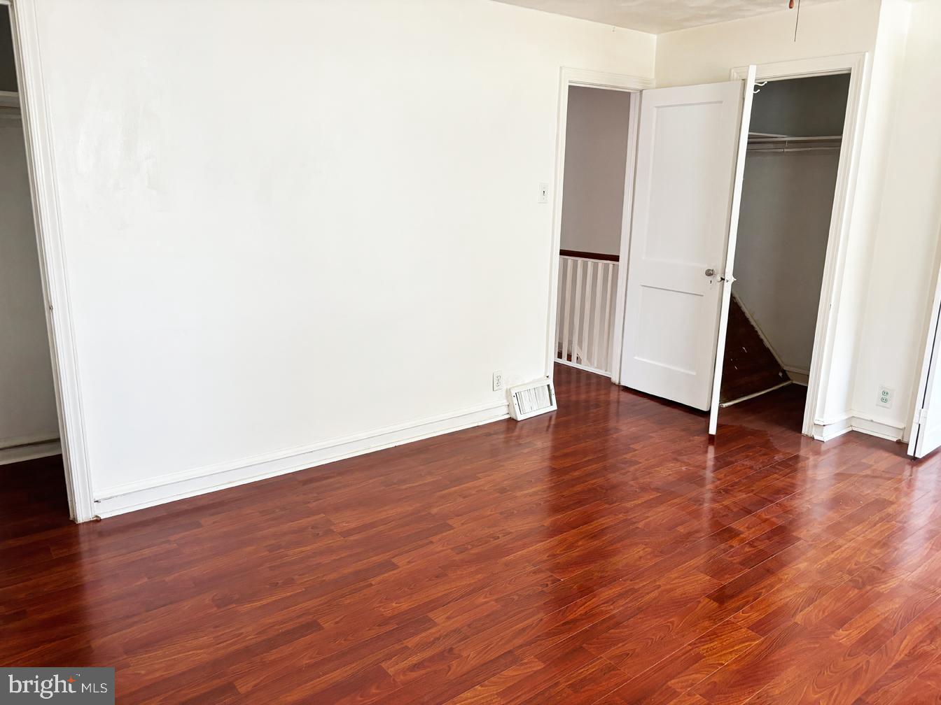 6034 Hasbrook Avenue Philadelphia, PA 19111 - Photo 12 of 14 an empty room with wooden floor and a window