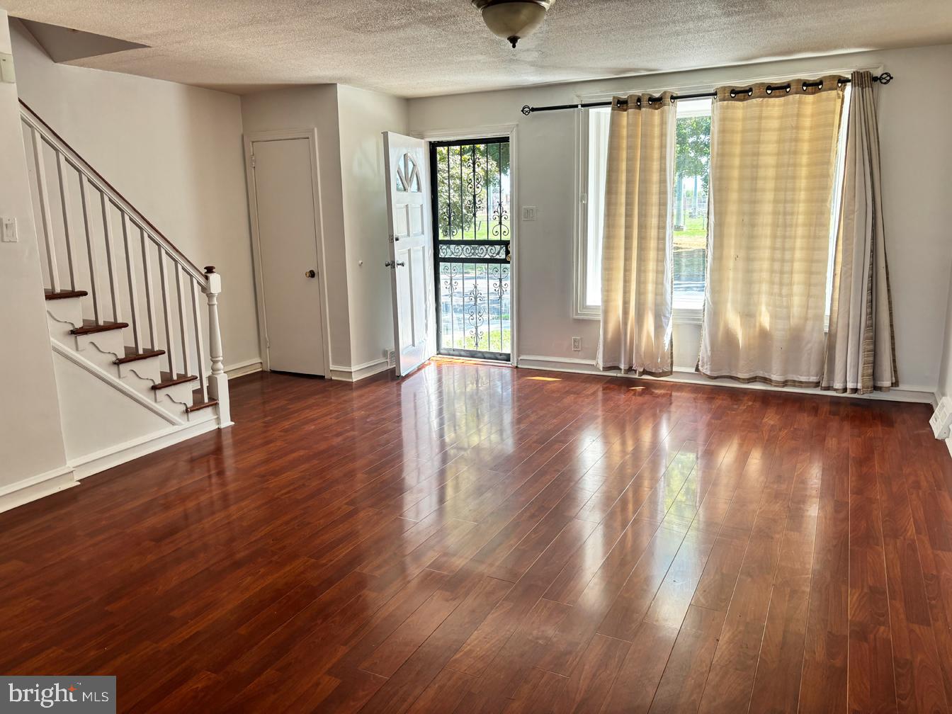 6034 Hasbrook Avenue Philadelphia, PA 19111 - Photo 3 of 14 wooden floor in an empty room with a window
