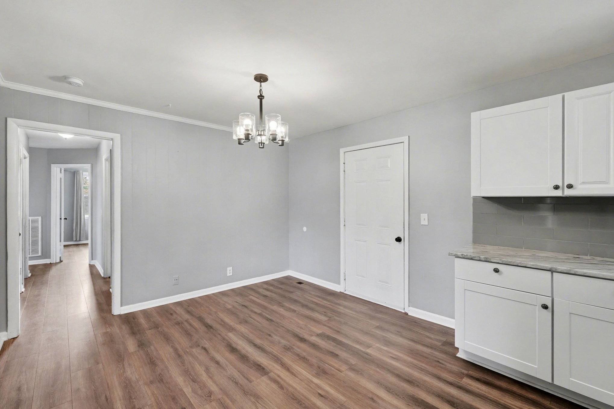 1214 Rutherford Street Murfreesboro, TN 37130 - Photo 11 of 32 a view of a kitchen with wooden floor and cabinets