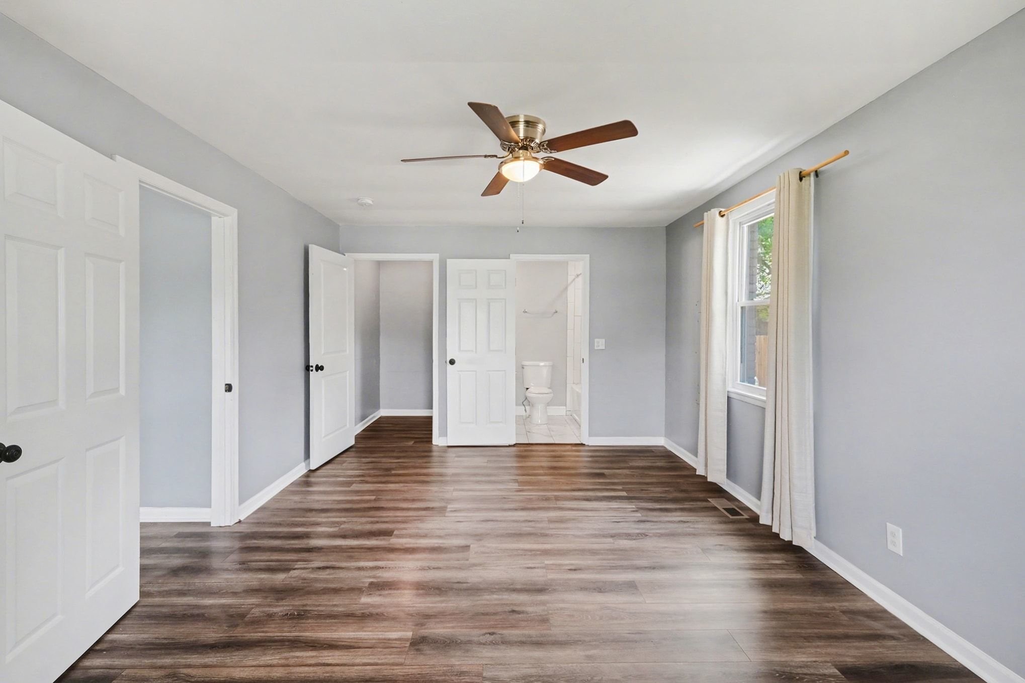1214 Rutherford Street Murfreesboro, TN 37130 - Photo 22 of 32 a view of empty room with wooden floor and fan