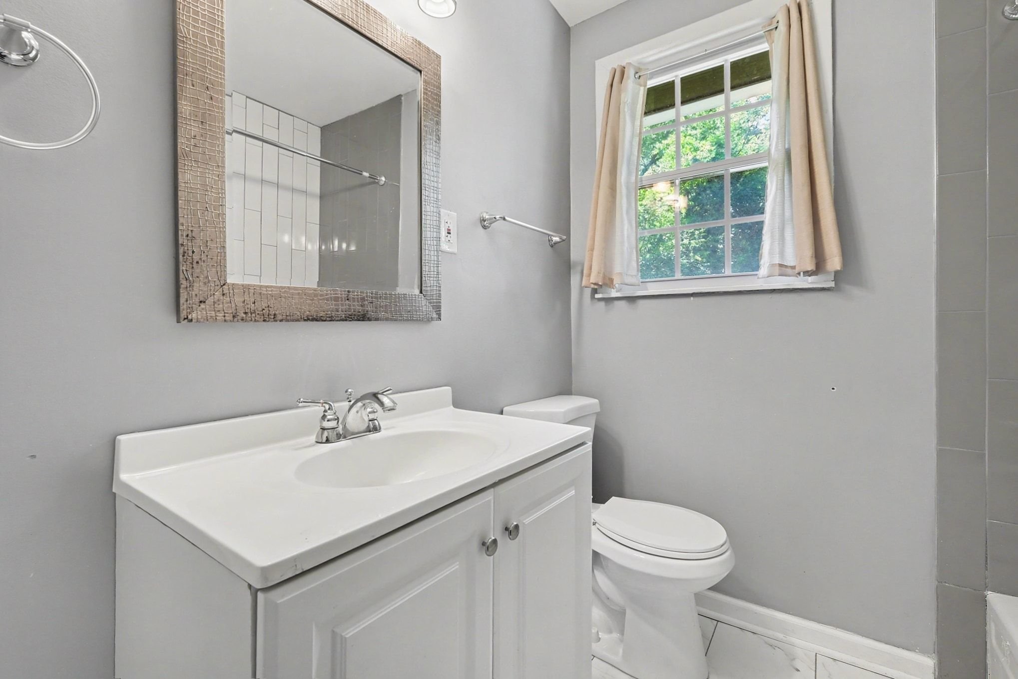 1214 Rutherford Street Murfreesboro, TN 37130 - Photo 23 of 32 a bathroom with a sink toilet and a mirror