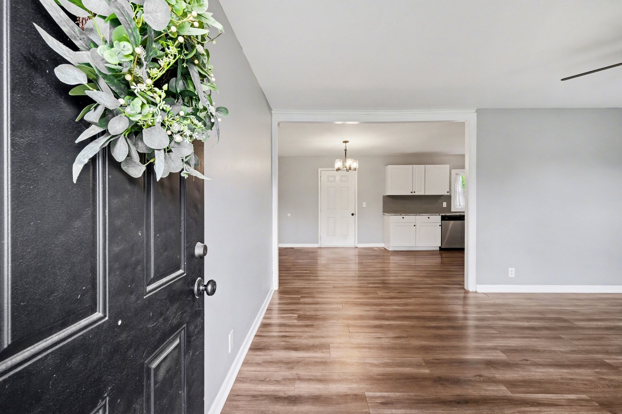 1214 Rutherford Street Murfreesboro, TN 37130 - Photo 4 of 32 a view of a hallway with wooden floor and a potted plant