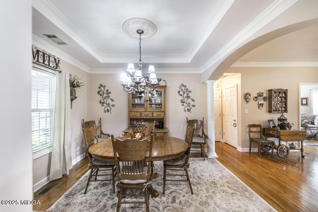 674 Mt Paran Road Lizella, GA 31052 - Photo 11 of 45 a view of a dining room with furniture window and wooden floor