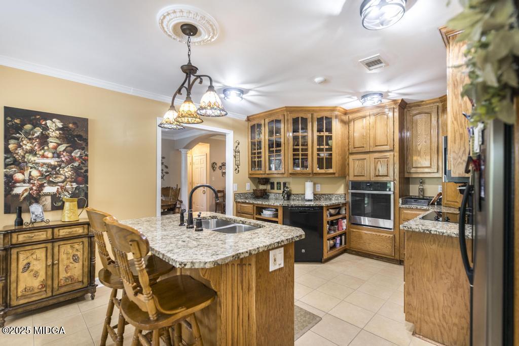 674 Mt Paran Road Lizella, GA 31052 - Photo 13 of 45 a kitchen area with granite countertop dining table and chairs