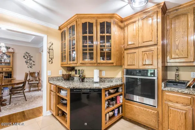 a kitchen with stainless steel appliances granite countertop a stove and a sink