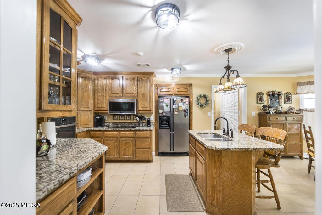 674 Mt Paran Road Lizella, GA 31052 - Photo 16 of 45 a kitchen with refrigerator and cabinets