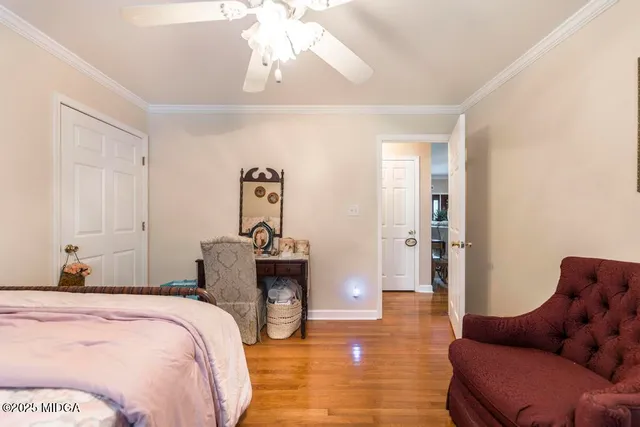 a bedroom with furniture and a chandelier