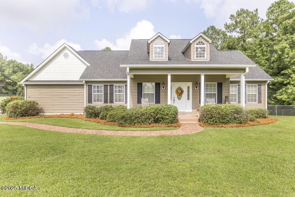674 Mt Paran Road Lizella, GA 31052 - Photo 2 of 45 front view of house with a garden