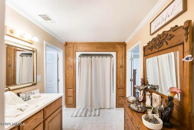 a bathroom with sink a mirror and a shower