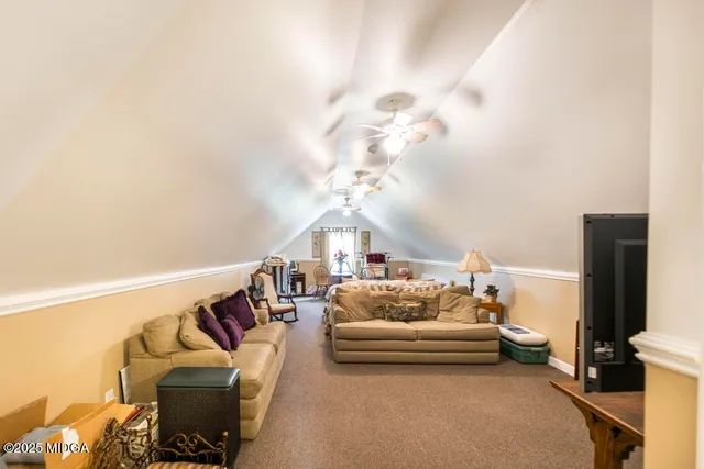 a bedroom with furniture and a chandelier