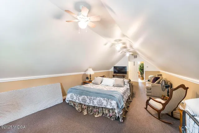 a bedroom with furniture and a chandelier