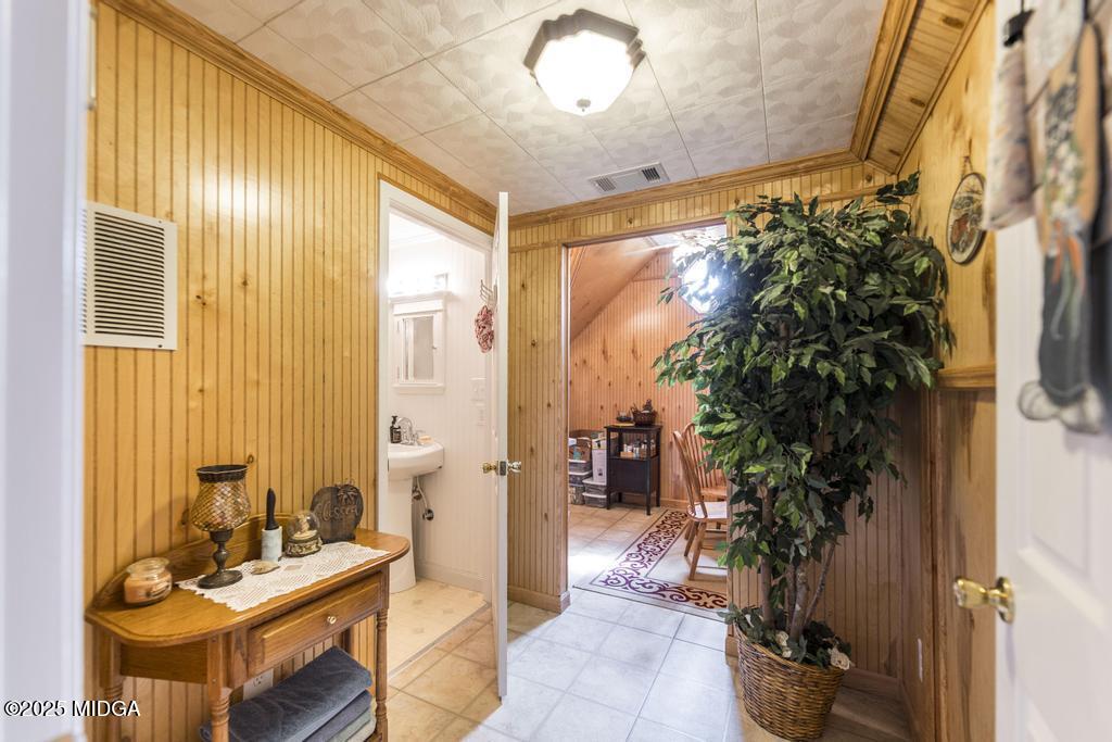 674 Mt Paran Road Lizella, GA 31052 - Photo 28 of 45 a living room with furniture and a potted plant