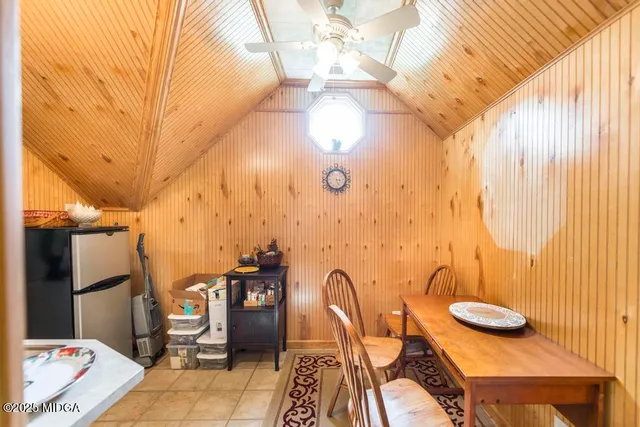 a balcony with table and chairs