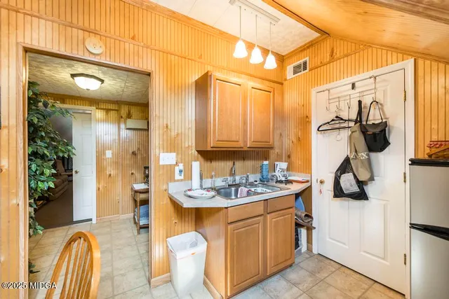 a bathroom with a sink double vanity and a mirror
