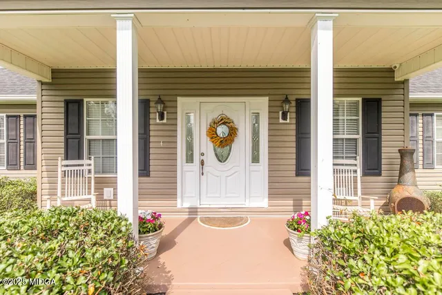 a front view of a house with large windows