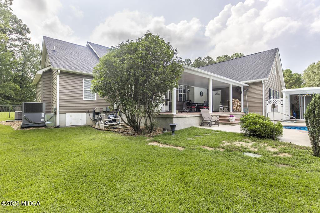 674 Mt Paran Road Lizella, GA 31052 - Photo 32 of 45 a view of a house with a backyard and a patio
