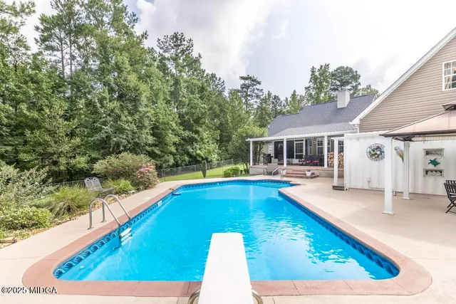 swimming pool view with seating space