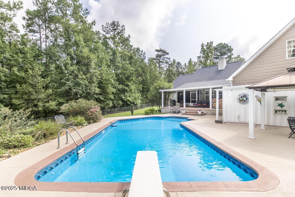 674 Mt Paran Road Lizella, GA 31052 - Photo 36 of 45 swimming pool view with seating space