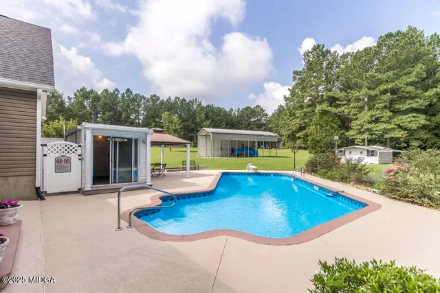 swimming pool view with seating space