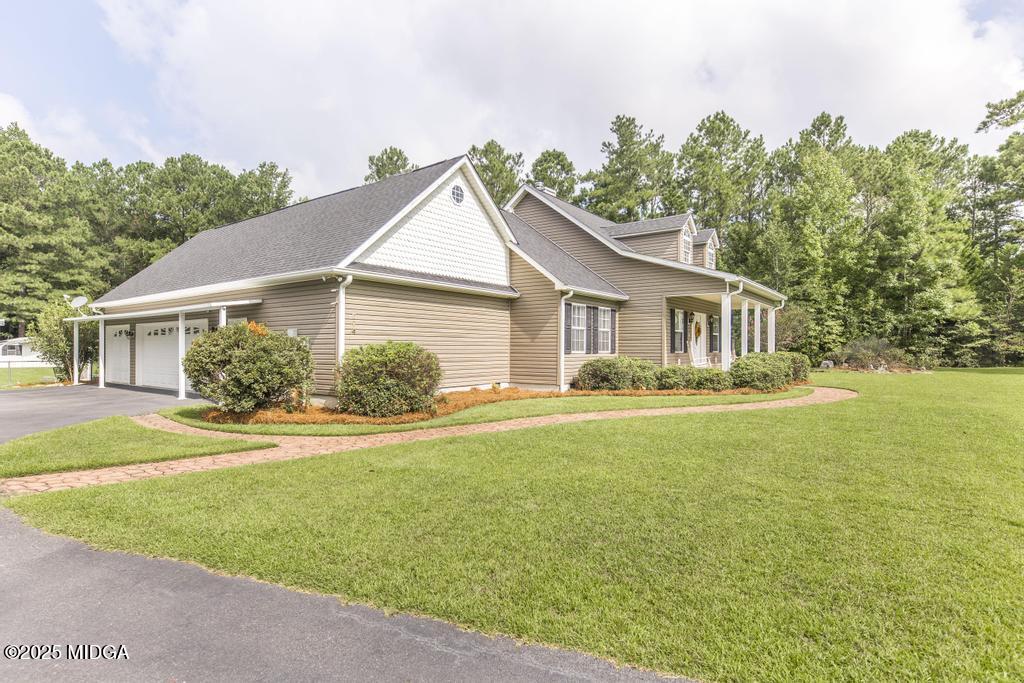 674 Mt Paran Road Lizella, GA 31052 - Photo 4 of 45 a front view of a house with yard and green space