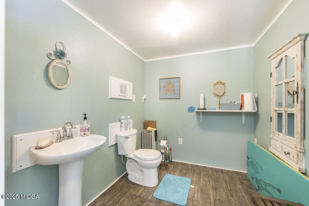 674 Mt Paran Road Lizella, GA 31052 - Photo 41 of 45 a bathroom with a toilet sink and mirror