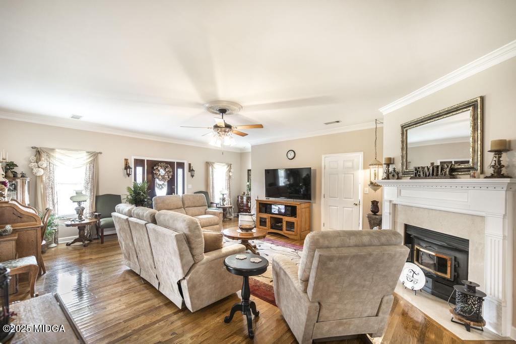 674 Mt Paran Road Lizella, GA 31052 - Photo 7 of 45 a living room with furniture a fireplace and a flat screen tv
