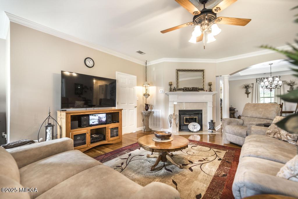 674 Mt Paran Road Lizella, GA 31052 - Photo 8 of 45 a living room with furniture a flat screen tv and a fireplace
