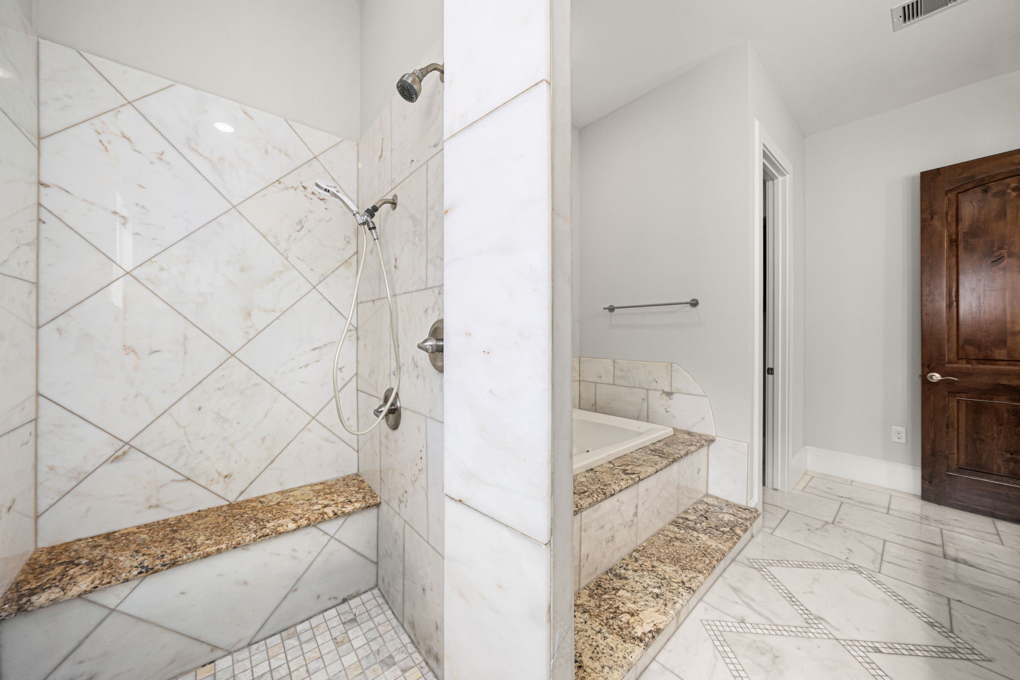 2022 Sabine Street Houston, TX 77007 - Photo 11 of 23 a bathroom with a tub and shower