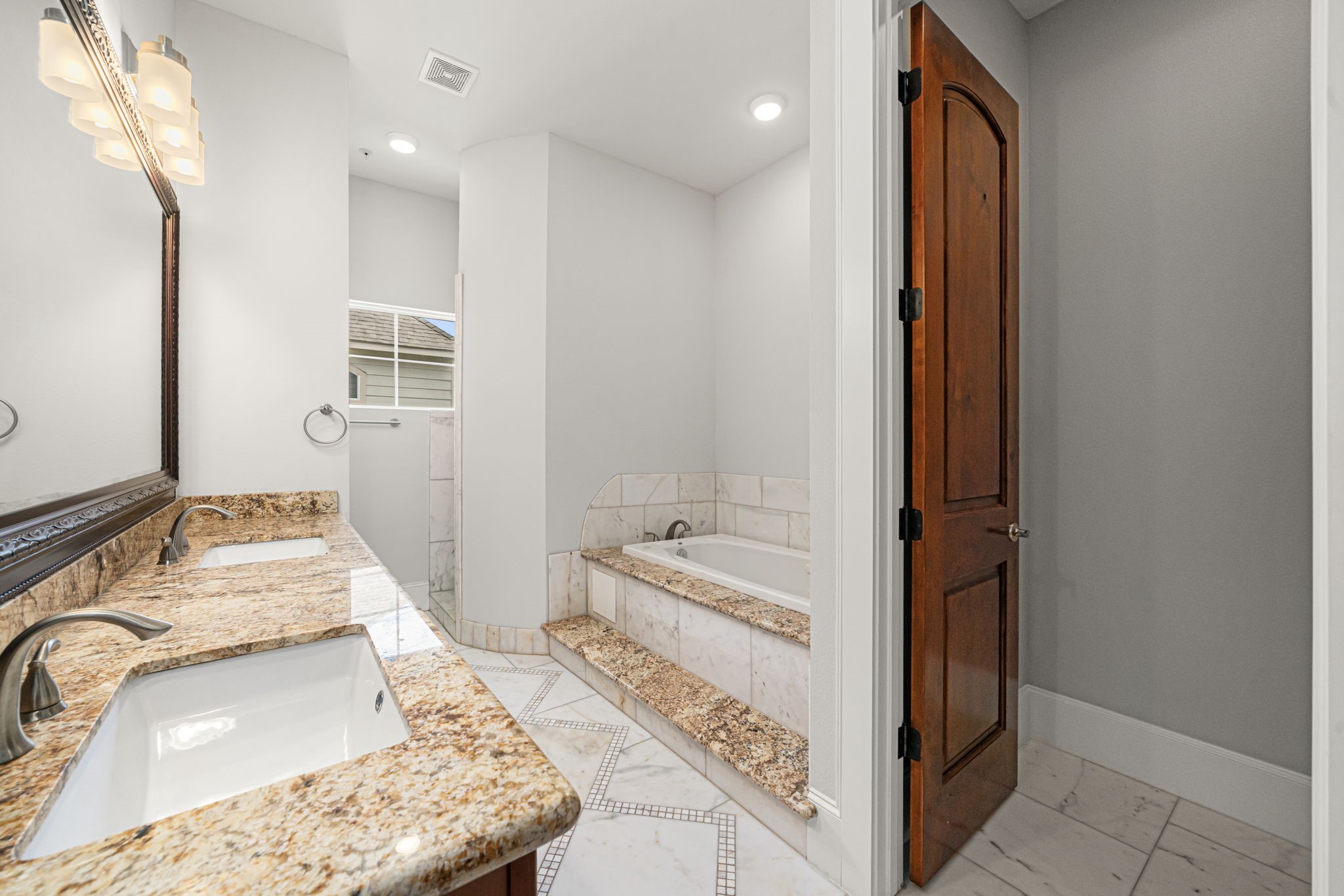 2022 Sabine Street Houston, TX 77007 - Photo 10 of 23 a bathroom with a sink and a mirror