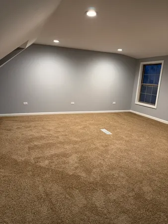 an empty room with an empty space and window