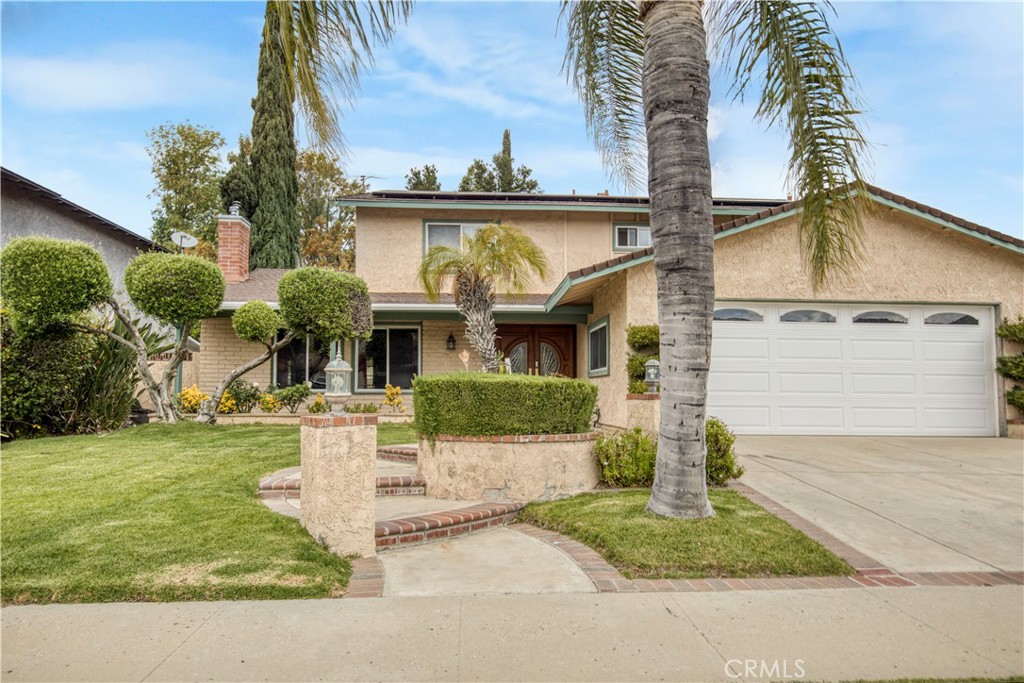 6449 Almar Street Simi Valley, CA 93063 - Photo 1 of 1 a front view of a house with garden