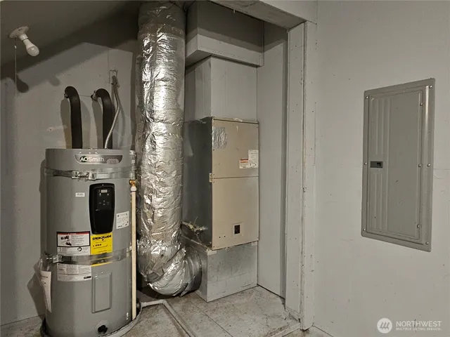 a view of living room with furniture and a fireplace