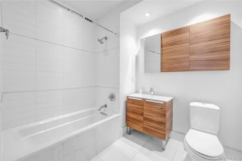 a bathroom with a toilet a sink and bathtub