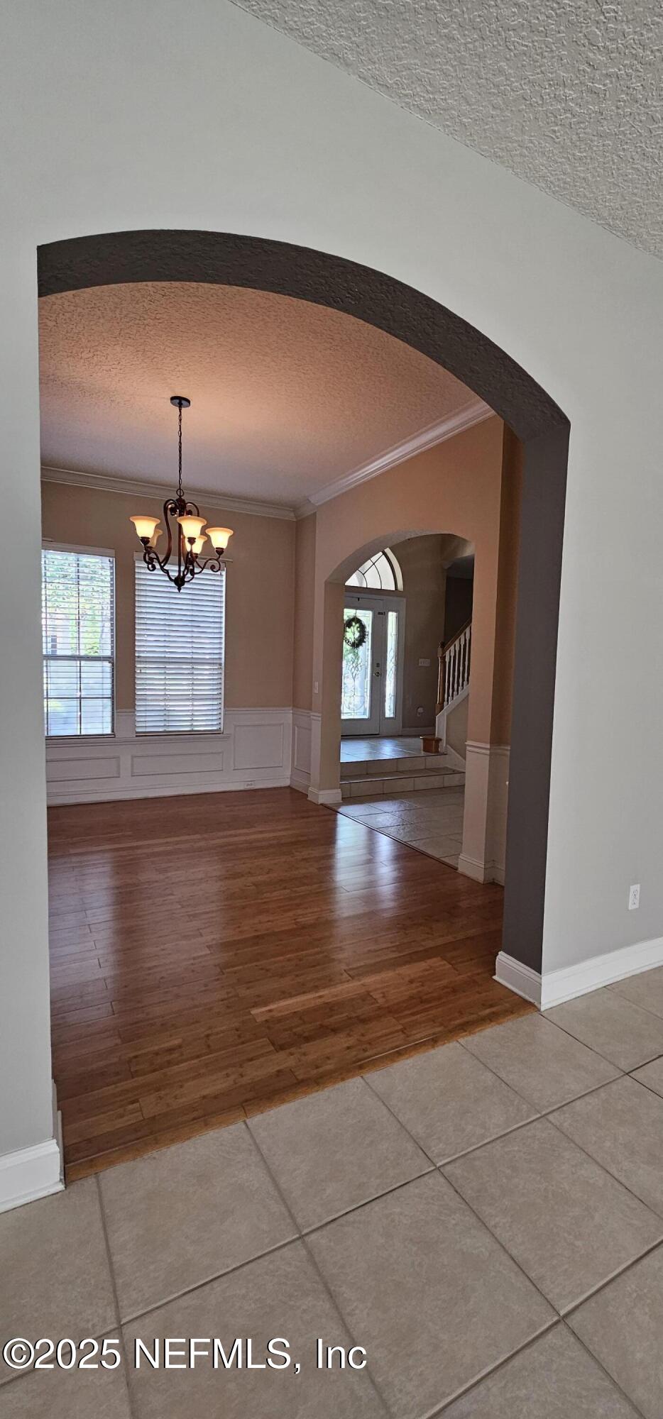 1741 Highland View Drive St. Augustine, FL 32092 - Photo 13 of 46 a view of a living room with hardwood floor and chandelier