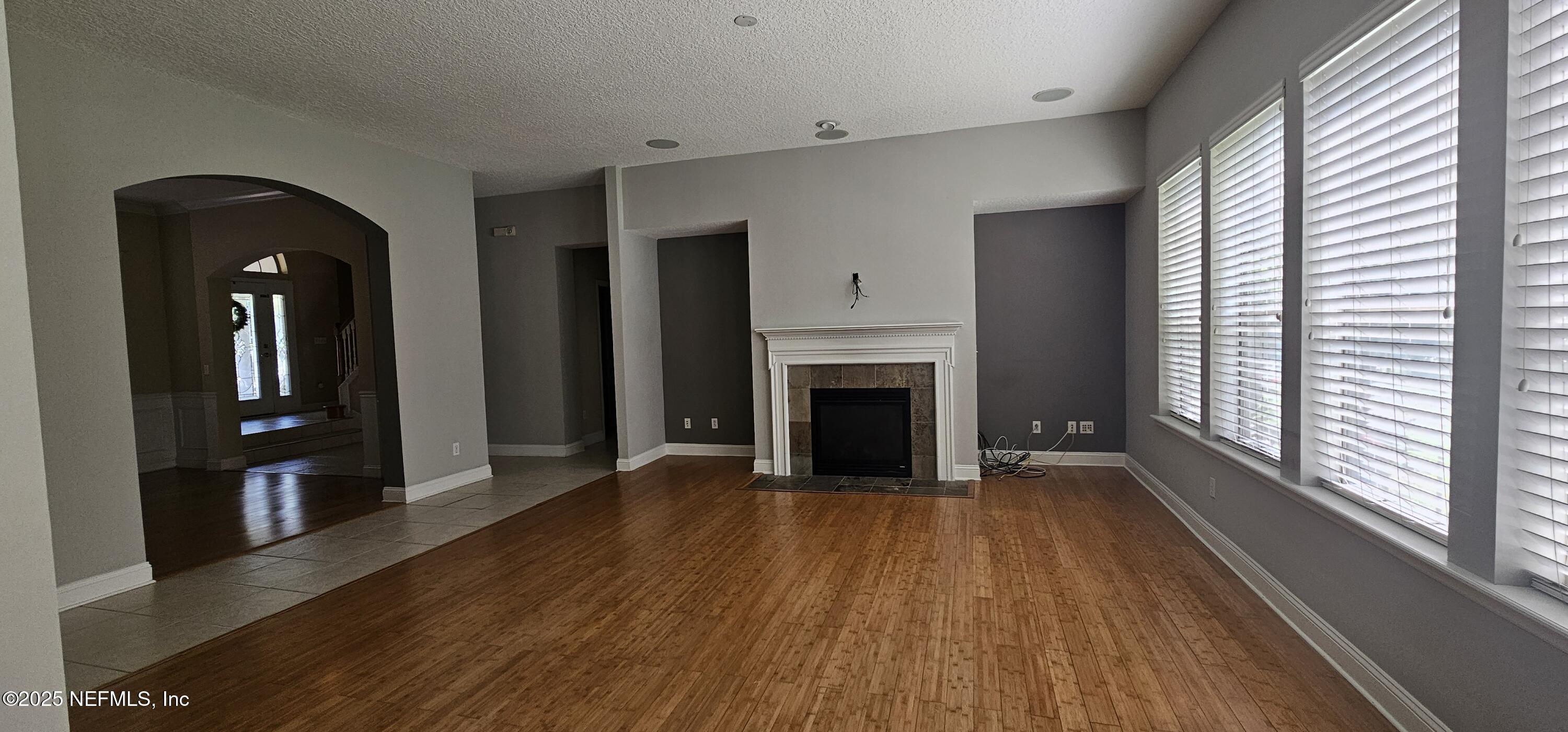 1741 Highland View Drive St. Augustine, FL 32092 - Photo 15 of 46 a view of a livingroom with wooden floor and a fireplace