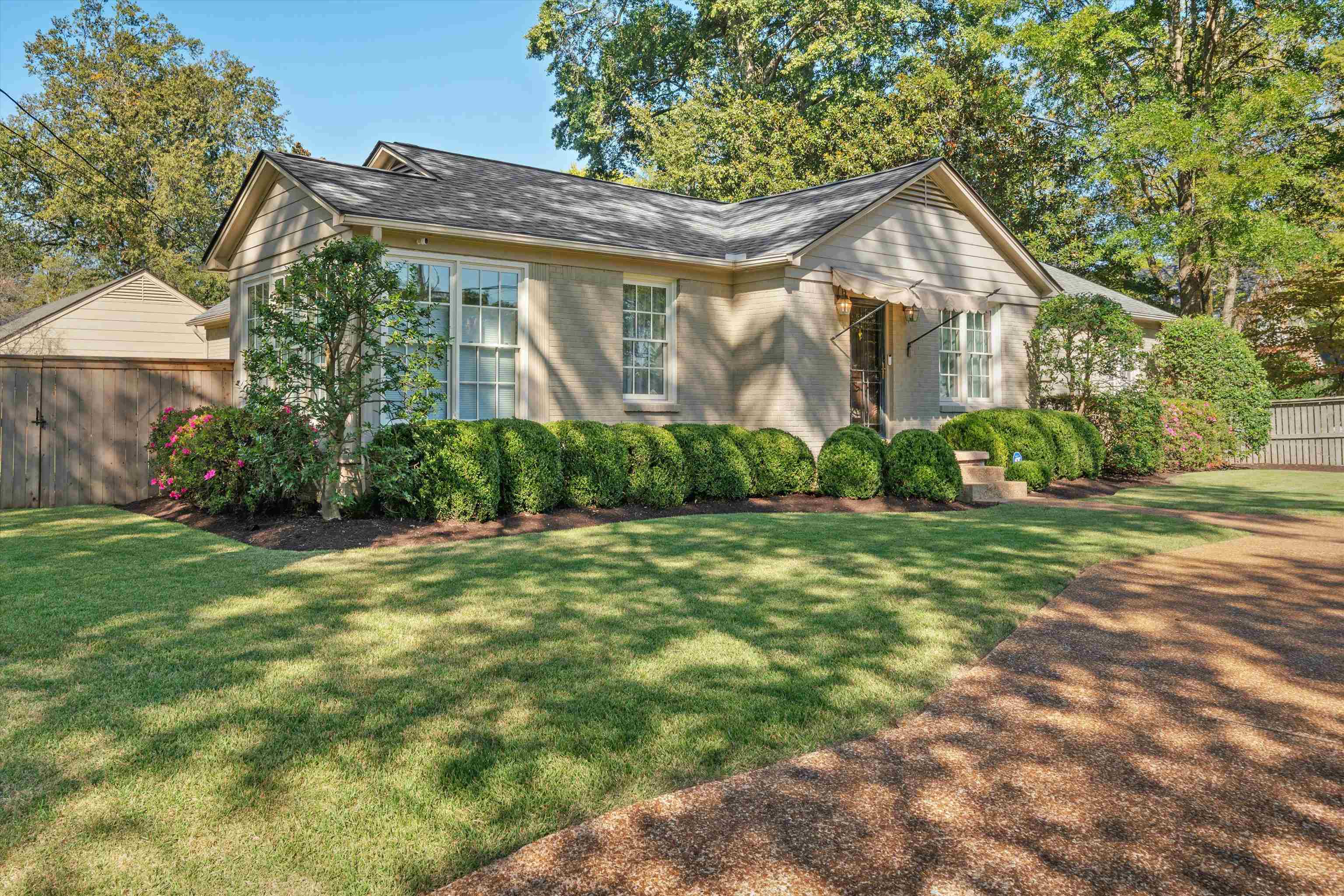 567 South Yates Road Memphis, TN 38120 - Photo 1 of 20 a front view of a house with a yard