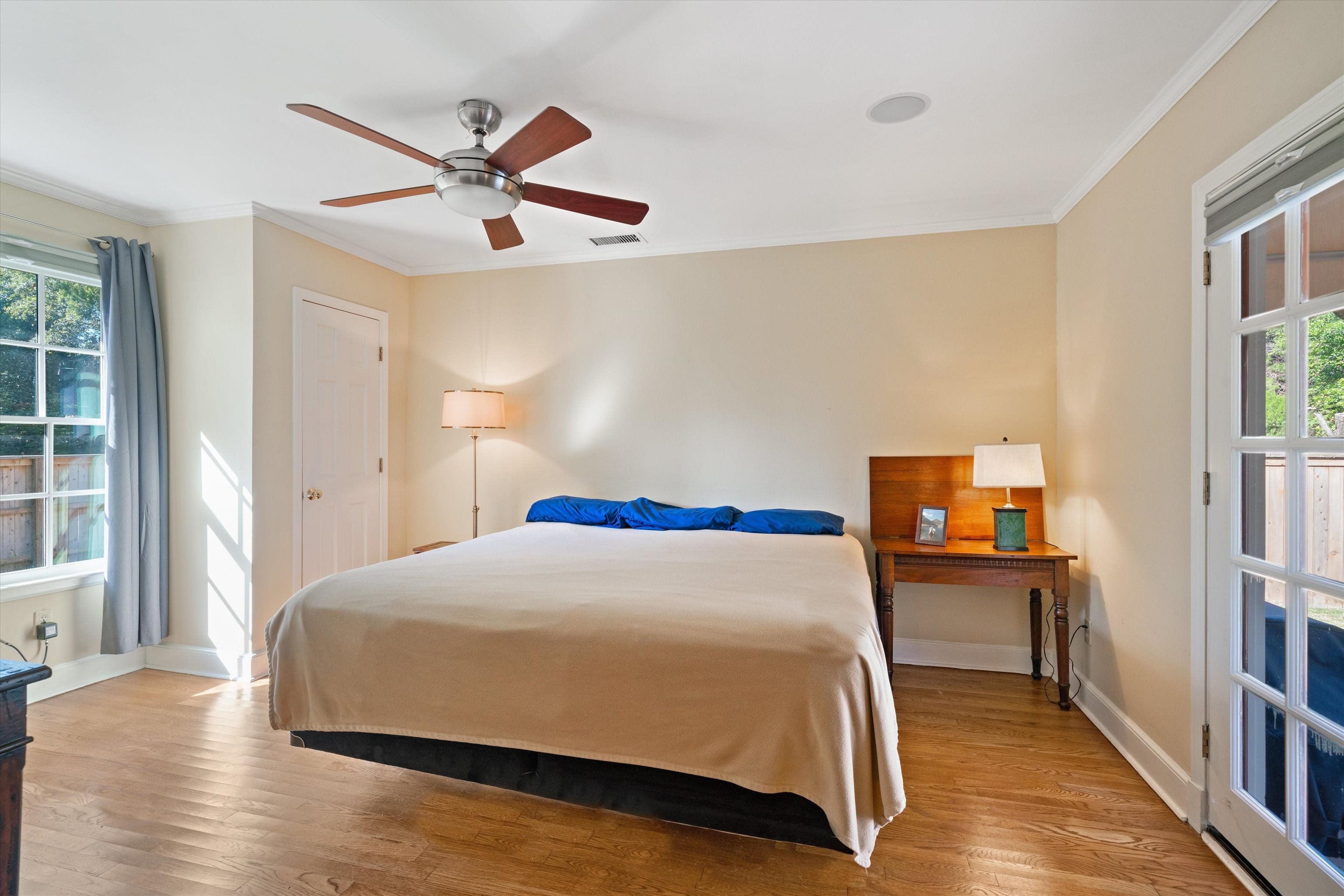 567 South Yates Road Memphis, TN 38120 - Photo 13 of 20 a bedroom with a bed and wooden floor