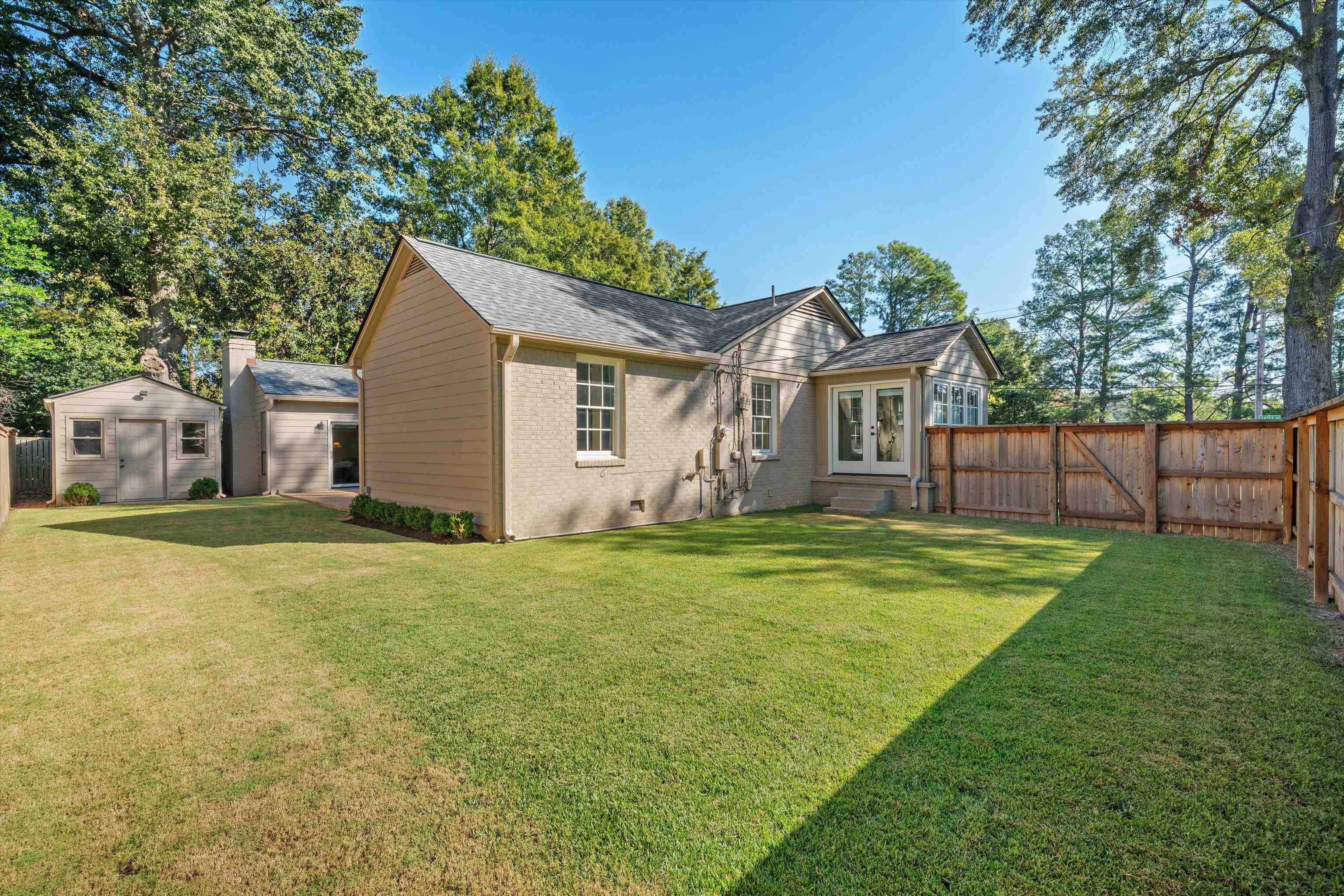 567 South Yates Road Memphis, TN 38120 - Photo 20 of 20 a view of a house with a yard and a tree