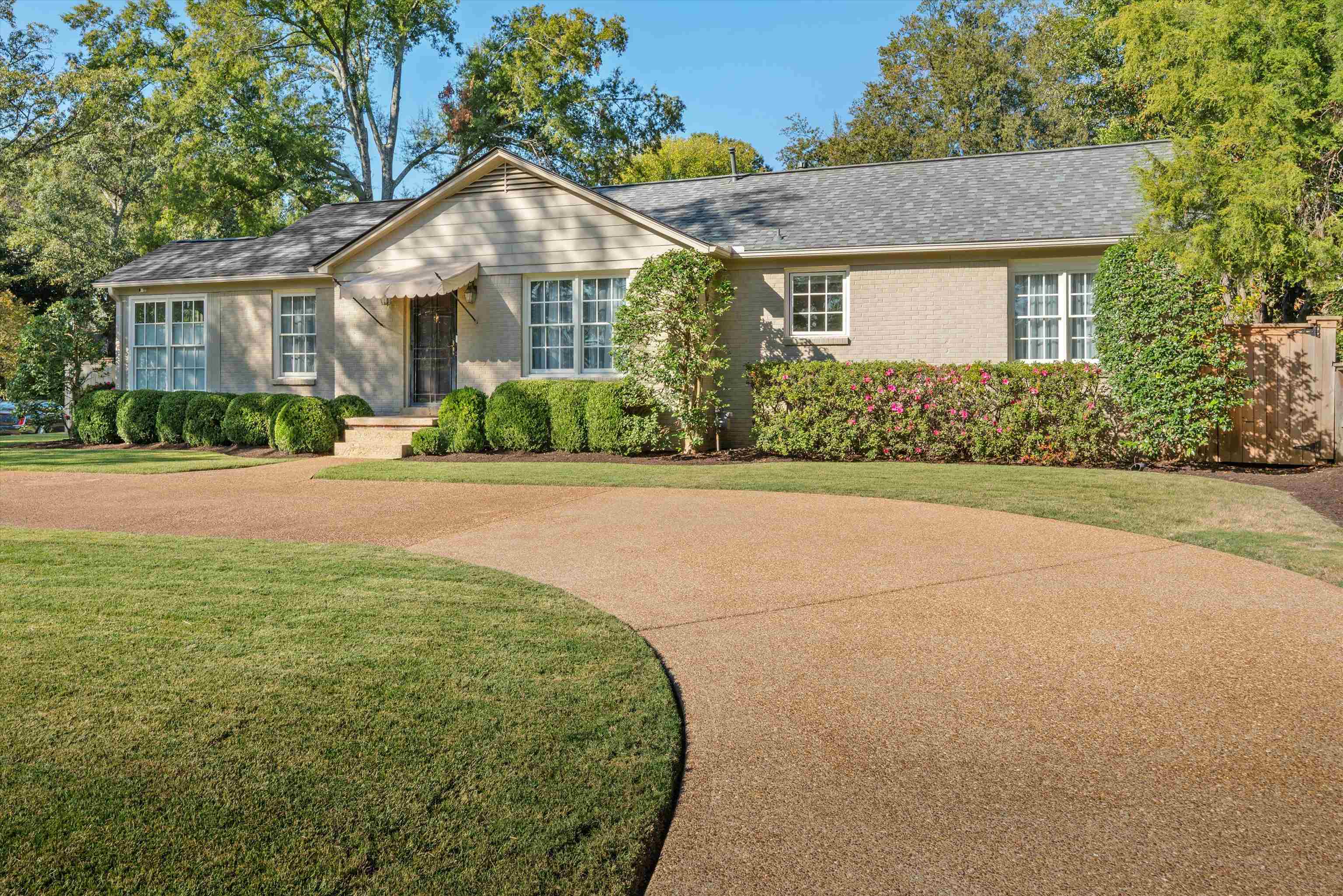 567 South Yates Road Memphis, TN 38120 - Photo 2 of 20 a front view of a house with a yard and garage